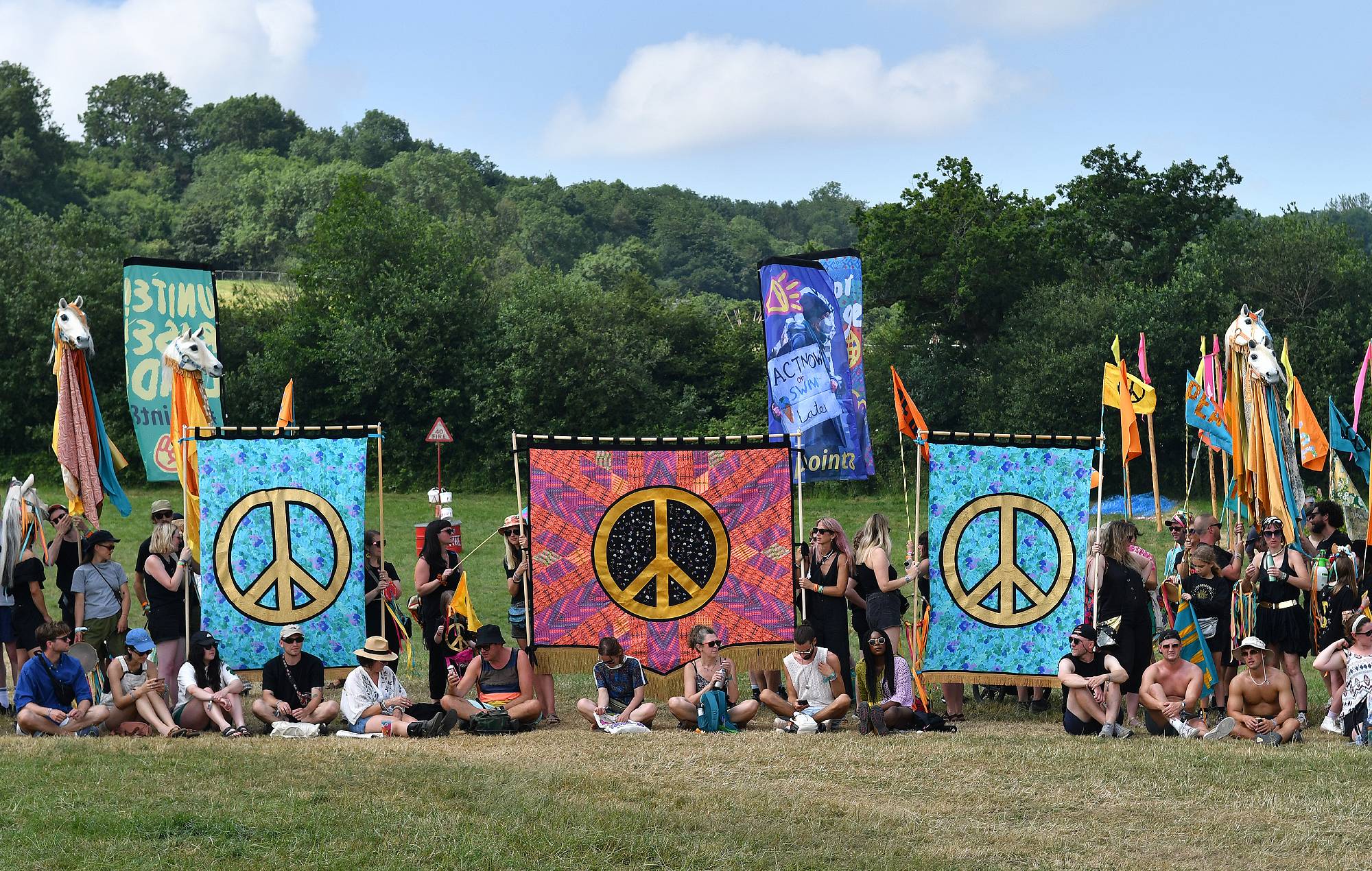 Festival goers participate in a peace procession during day 2 of Glastonbury Festival 2023 at Worthy Farm, Pilton on June 22, 2023 in Glastonbury, England. (Photo by Jim Dyson/Redferns)
