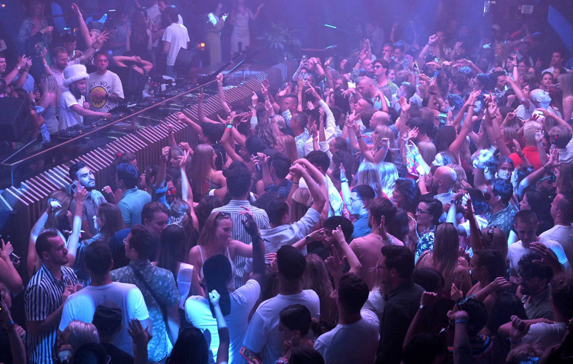 People party at the Pacha Ibiza nightclub in Ibiza, on June 16, 2022. Credit: LLUIS GENE/AFP via Getty Images