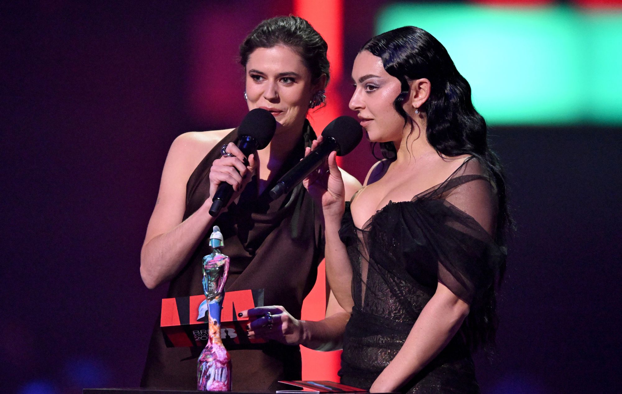  Alison Oliver and Charli XCX on stage during the BRIT Awards 2024 at The O2 Arena on March 02, 2024 in London, England. 