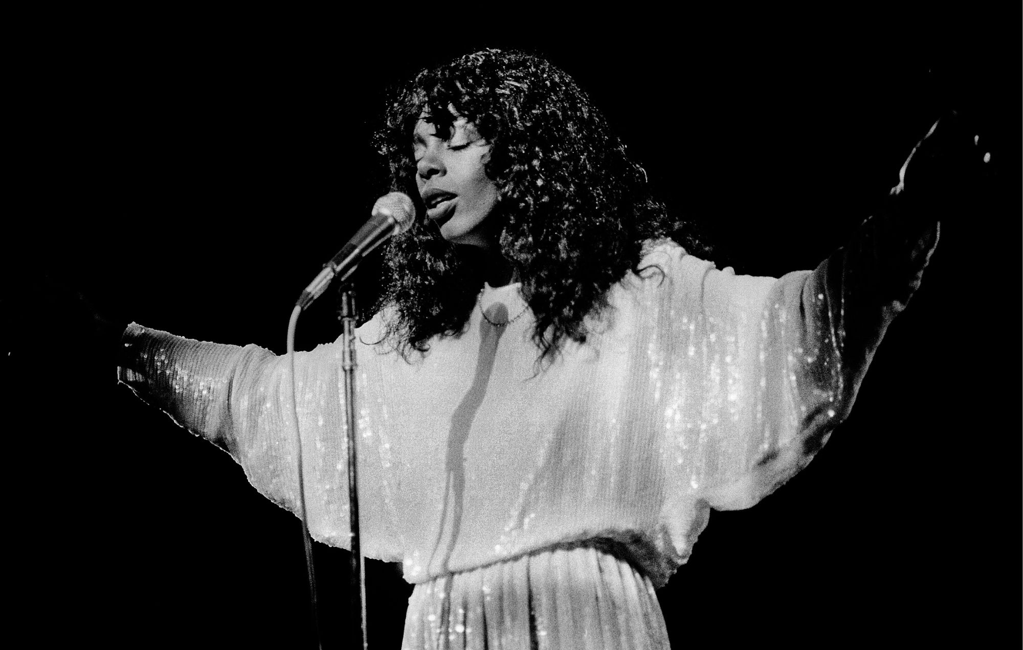 Donna Summer performs onstage in Illinois, 1983.