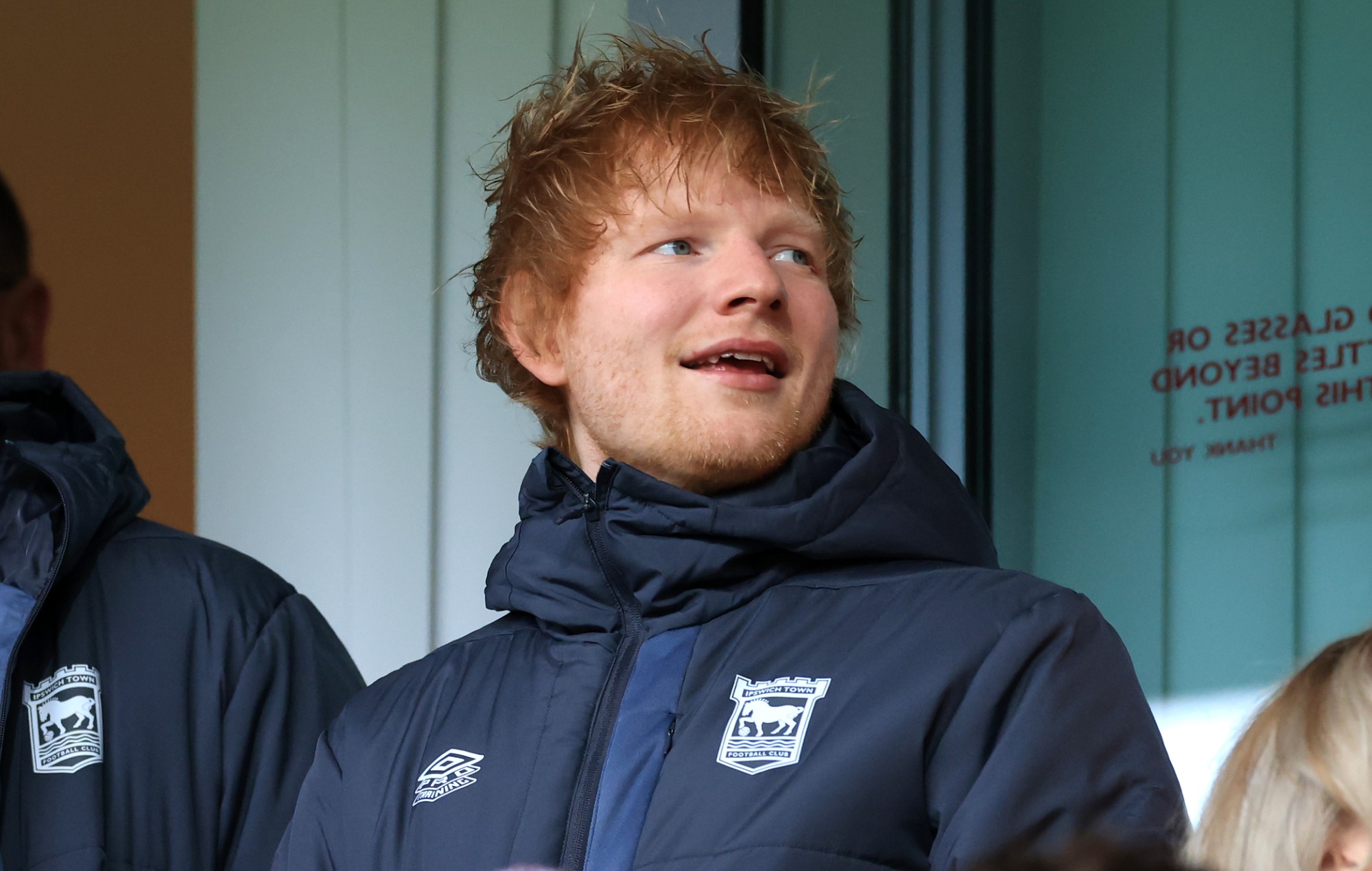 Singer-songwriter Ed Sheeran is seen in the stands prior to the Sky Bet Championship match between Ipswich Town and Norwich City at Portman Road on December 16, 2023 in Ipswich, England