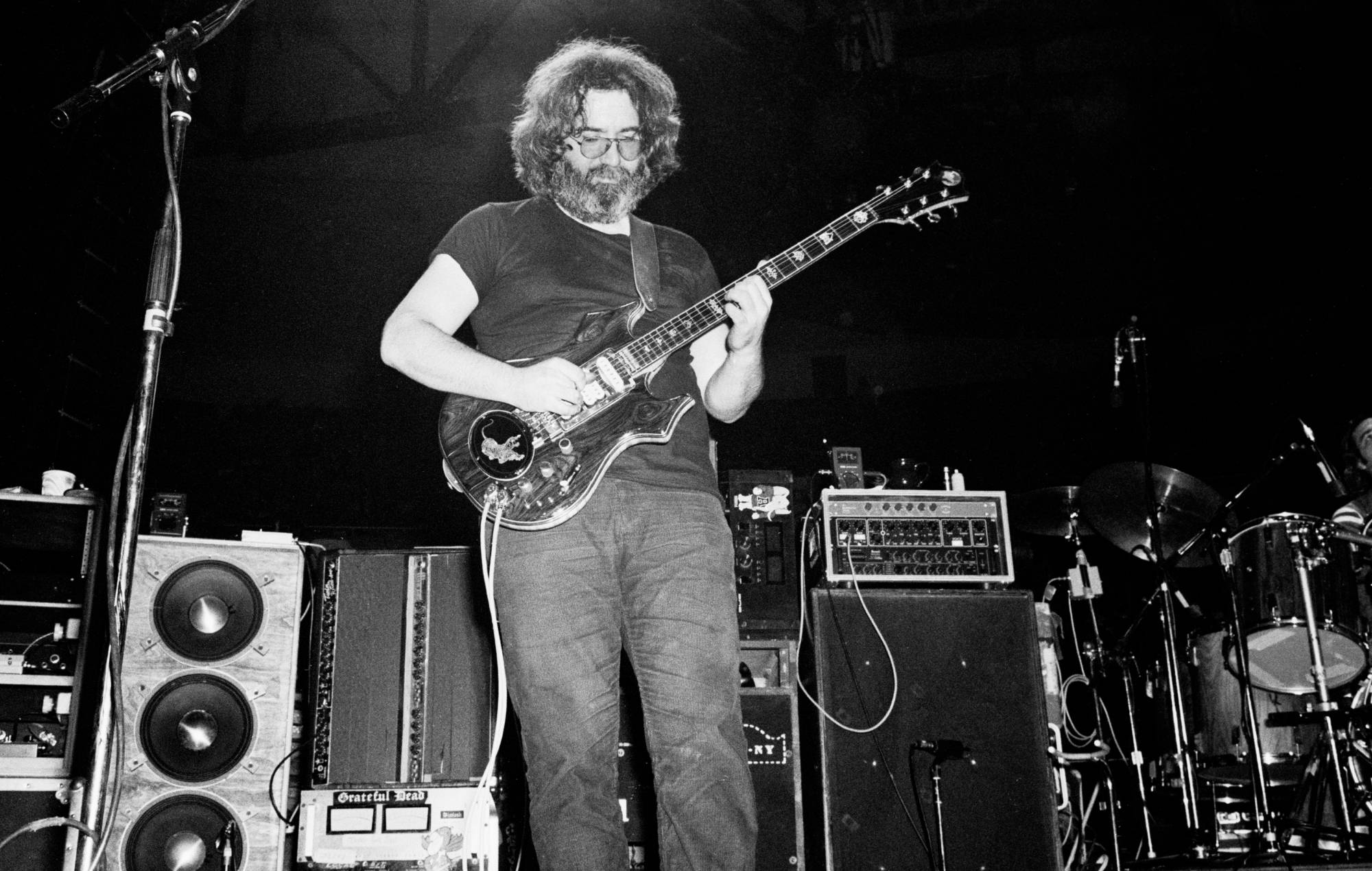 Jerry Garcia of the group Grateful Dead, plays an electric guitar as he performs onstage at Nassau Coliseum (later Nassau Veterans Memorial Coliseum), Uniondale, New York, November 1, 1979. (Photo by Gary Gershoff/Getty Images)