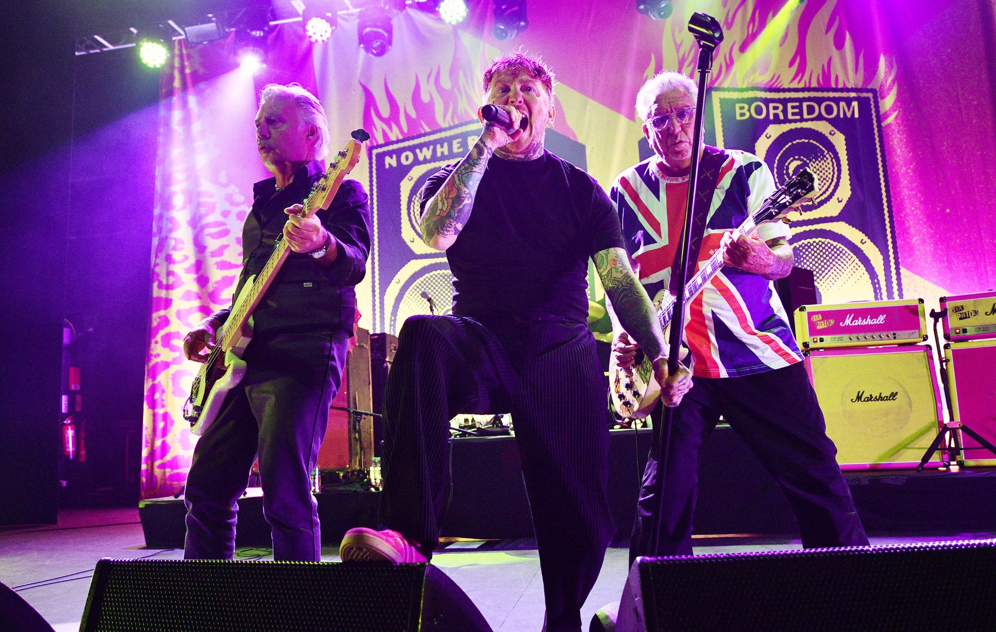 Frank Carter (C) performs with Glen Matlock and Steve Jones of the Sex Pistols in 2024